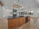 Open concept kitchen with large island and living area view at 2728 Sunrise Landing Ln, Lakeland, FL 33812