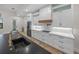 Modern kitchen with white cabinets, wood island, and a gold faucet at 2728 Sunrise Landing Ln, Lakeland, FL 33812