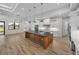 Open concept kitchen with large island and wood flooring at 2728 Sunrise Landing Ln, Lakeland, FL 33812