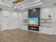 Spacious living area with hardwood floors and a statement fireplace at 2728 Sunrise Landing Ln, Lakeland, FL 33812
