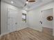 Spacious office with wood-look floors, ceiling fan, and a window at 2728 Sunrise Landing Ln, Lakeland, FL 33812