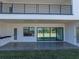 Covered patio with outdoor kitchen and large sliding doors at 2728 Sunrise Landing Ln, Lakeland, FL 33812