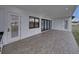 Spacious patio with tile flooring, sliding doors and a door at 2728 Sunrise Landing Ln, Lakeland, FL 33812
