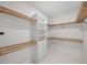 Bright walk-in closet with ample shelving and hanging space at 2728 Sunrise Landing Ln, Lakeland, FL 33812