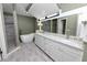 Elegant bathroom with double vanity, soaking tub, and shower at 3164 Stonewater Dr # 3164, Lakeland, FL 33803
