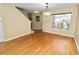 Bright dining area with hardwood floors and access to kitchen and stairs at 3164 Stonewater Dr # 3164, Lakeland, FL 33803