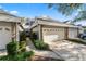 Two-story townhome with attached two-car garage and landscaped walkway at 3164 Stonewater Dr # 3164, Lakeland, FL 33803