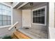 Townhome's front entrance with wooden steps and a window at 3164 Stonewater Dr # 3164, Lakeland, FL 33803