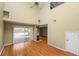 High-ceilinged living room with hardwood floors, fireplace and sliding glass doors at 3164 Stonewater Dr # 3164, Lakeland, FL 33803