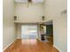 Spacious living room with hardwood floors, fireplace and high ceilings at 3164 Stonewater Dr # 3164, Lakeland, FL 33803
