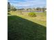 Enjoy a peaceful backyard view of a lake and homes at 3604 Julius Estates Blvd, Winter Haven, FL 33881