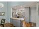 Modern kitchen with gray cabinets, granite counters, and stainless steel appliances at 5225 Imperial Lakes Blvd # 44, Mulberry, FL 33860