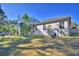 Spacious backyard with a screened enclosure and lush landscaping at 5635 Canvasback Ct, Lakeland, FL 33805