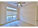 Bright bedroom with large window and ceiling fan at 5635 Canvasback Ct, Lakeland, FL 33805