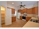 Kitchen with wood cabinets, pantry and appliances at 5635 Canvasback Ct, Lakeland, FL 33805