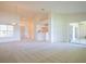 Open concept living area with view into kitchen and patio at 5671 Water Oak Ln, Mulberry, FL 33860