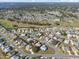 Aerial view of homes in a residential area with golf course at 5946 Chickadee Dr, Lakeland, FL 33809