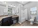 Well-appointed bathroom featuring corner vanity, tub/shower combo, and tile flooring at 5946 Chickadee Dr, Lakeland, FL 33809