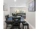 Dining area with dark wood table and bench seating, overlooking the living room at 6817 Estate Rd, Lakeland, FL 33809