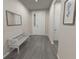 Welcoming entryway with a bench and a mirror at 715 Sw 77Th Cir, Ocala, FL 34474