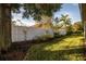 Fenced backyard with a white vinyl fence and landscaping at 819 Christina Chase Dr, Lakeland, FL 33813