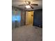 Spacious bedroom with carpet, ceiling fan, and ample closet space at 1610 Reynolds Rd # 211, Lakeland, FL 33801