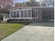 Single-wide manufactured home with carport and mature landscaping at 1610 Reynolds Rd # 211, Lakeland, FL 33801