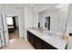 Bathroom boasting a double vanity, granite countertops, and a shower/tub combo at 1754 Eagle Hammock Blvd, Eagle Lake, FL 33839