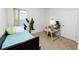 Cozy bedroom with a bed, small desk, and simple decor at 1754 Eagle Hammock Blvd, Eagle Lake, FL 33839