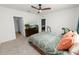 Bedroom featuring carpeted flooring, a ceiling fan, and access to another room at 1754 Eagle Hammock Blvd, Eagle Lake, FL 33839
