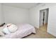 Spacious bedroom with a comfortable bed, carpeted floors, and ample natural light at 1754 Eagle Hammock Blvd, Eagle Lake, FL 33839