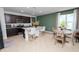 Kitchen and dining area with dark cabinets, an island, and a round dining table at 1754 Eagle Hammock Blvd, Eagle Lake, FL 33839