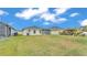 Spacious backyard with screened-in patio and lush green lawn at 1968 Harvest Landing Cir, Lakeland, FL 33810