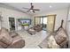 Inviting living room with access to the patio and ample natural light at 303 Lake Mariana Pl, Auburndale, FL 33823