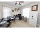 Home office with two desks, a safe, and large windows providing ample natural light at 303 Lake Mariana Pl, Auburndale, FL 33823