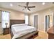 Large bedroom with ensuite bathroom access, ceiling fan, and carpeted flooring at 3226 Oak Tree Ln, Winter Haven, FL 33884
