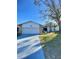 House exterior featuring a two-car garage and well-maintained lawn at 3709 Feather Dr, Lakeland, FL 33812