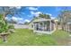 Fenced backyard with a screened porch and storage shed at 4617 S Devon Ave, Lakeland, FL 33813