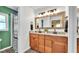 Modern bathroom with double vanity, updated fixtures, and tiled shower at 4617 S Devon Ave, Lakeland, FL 33813