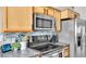 Updated kitchen featuring stainless steel appliances, sleek countertops, and ample storage at 4617 S Devon Ave, Lakeland, FL 33813