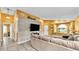 Inviting living room with wood accent wall, comfortable seating, and tile flooring at 4617 S Devon Ave, Lakeland, FL 33813