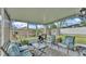 Relaxing screened porch with comfortable seating, perfect for enjoying the outdoors at 4617 S Devon Ave, Lakeland, FL 33813