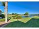 Spacious backyard with pond view, lush landscaping, and a peaceful atmosphere at 535 Narrow Pond Rd, Polk City, FL 33868