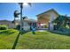 Landscaped backyard with a patio and pool at 535 Narrow Pond Rd, Polk City, FL 33868