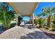 Covered patio with pavers and golf cart garage at 535 Narrow Pond Rd, Polk City, FL 33868