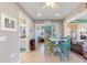 Bright dining area with table and chairs, offering views into adjacent rooms at 535 Narrow Pond Rd, Polk City, FL 33868