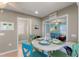 Small dining area with round table and four chairs, near kitchen at 535 Narrow Pond Rd, Polk City, FL 33868