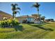 House exterior with landscaping and palm trees at 535 Narrow Pond Rd, Polk City, FL 33868