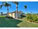 House exterior showcasing landscaping and palm trees at 535 Narrow Pond Rd, Polk City, FL 33868
