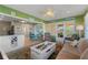 Open living space with kitchen, seating area, and access to backyard at 535 Narrow Pond Rd, Polk City, FL 33868